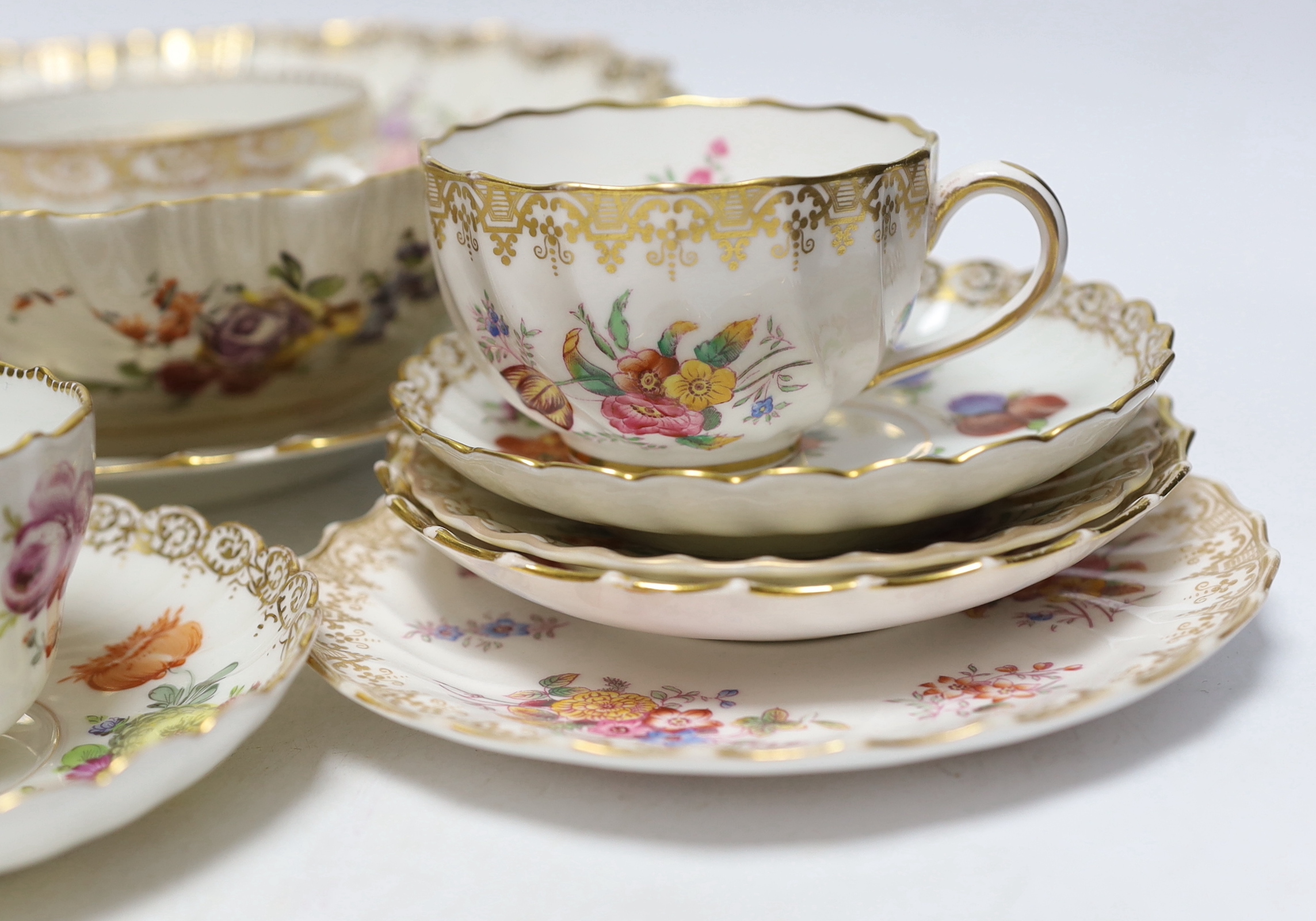 A group of Dresden porcelain floral tea wares, largest 24cm in diameter